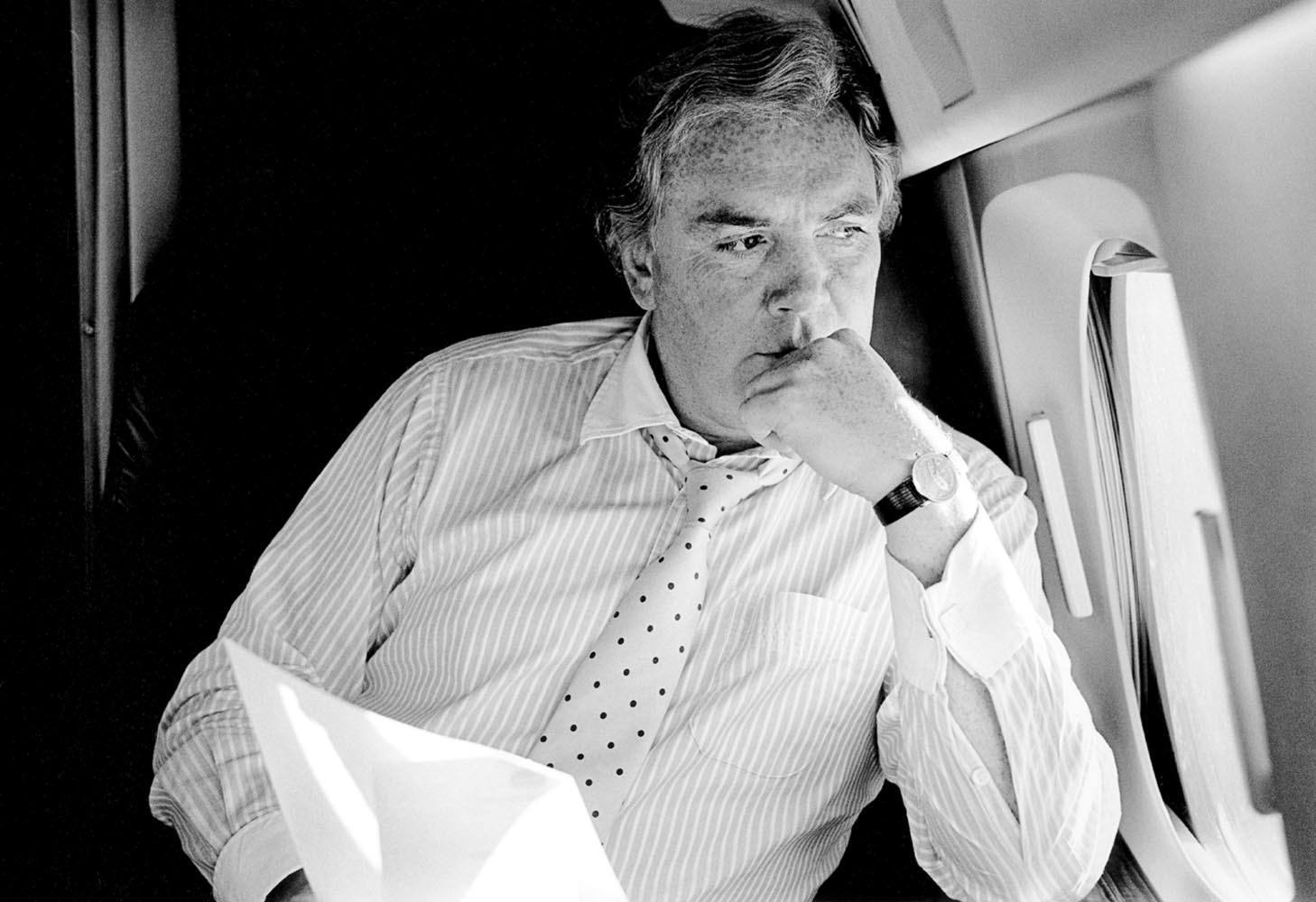 Tony O’Reilly by Jet Window,  en route to Ireland, 1987© Rodney Smith