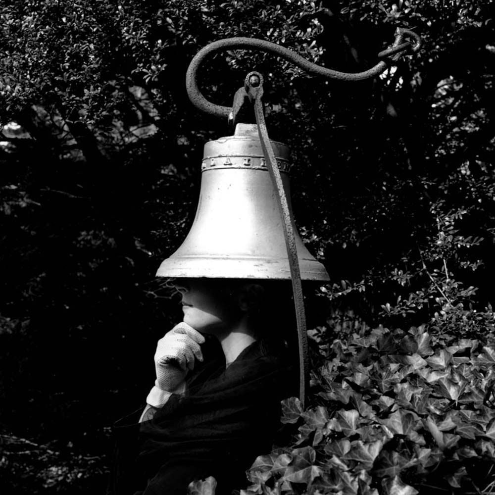 Pamela with Head under Bell, Snedens Landing, New York, 1991© Rodney Smith