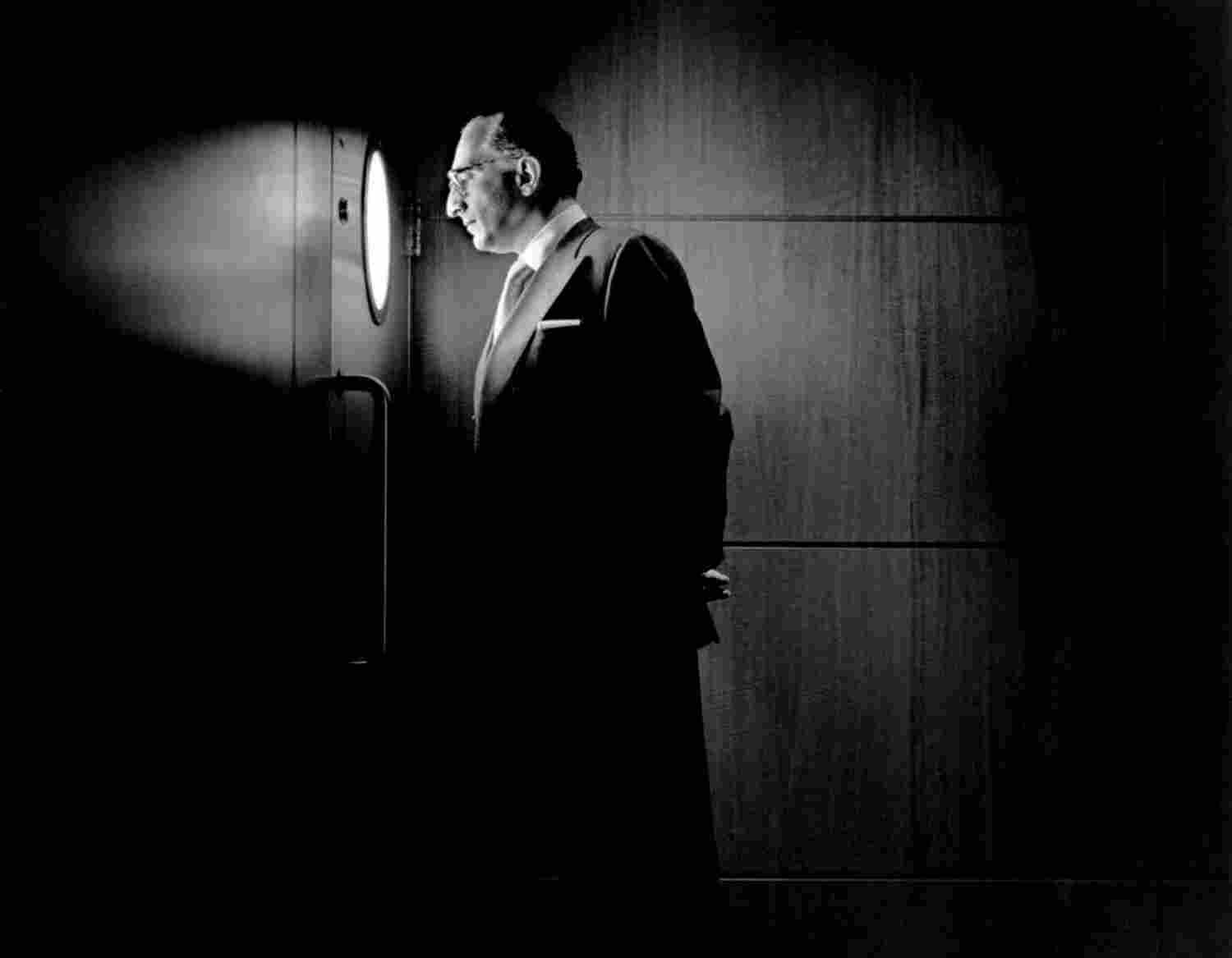 Man Looking out Small Window Times Square, New York City, New York, 1996© Rodney Smith