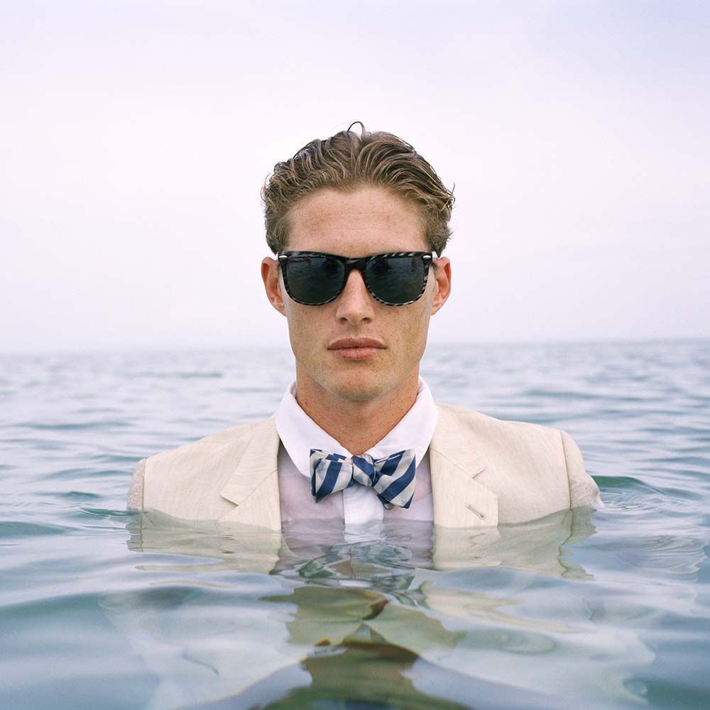 Jimmy Standing in Ocean Wearing Sun Glasses,  Dominican Republic, 2010© Rodney Smith