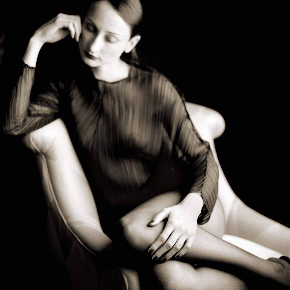 Bernadette Sitting on Chair, Burden Mansion, New York City, New York, 1995© Rodney Smith