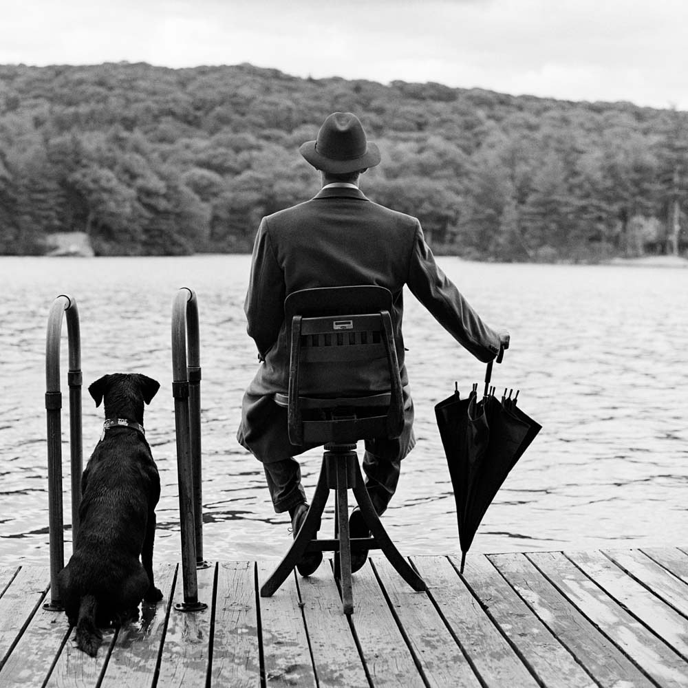 Avril Fisk Seated on Dock with Dog, Harriman, New York, 1994© Rodney Smith