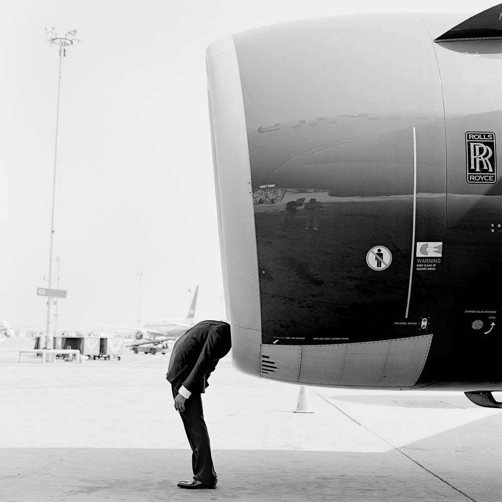 Jonathan with Head in Engine, JFK Airport, New York, 2007© Rodney Smith