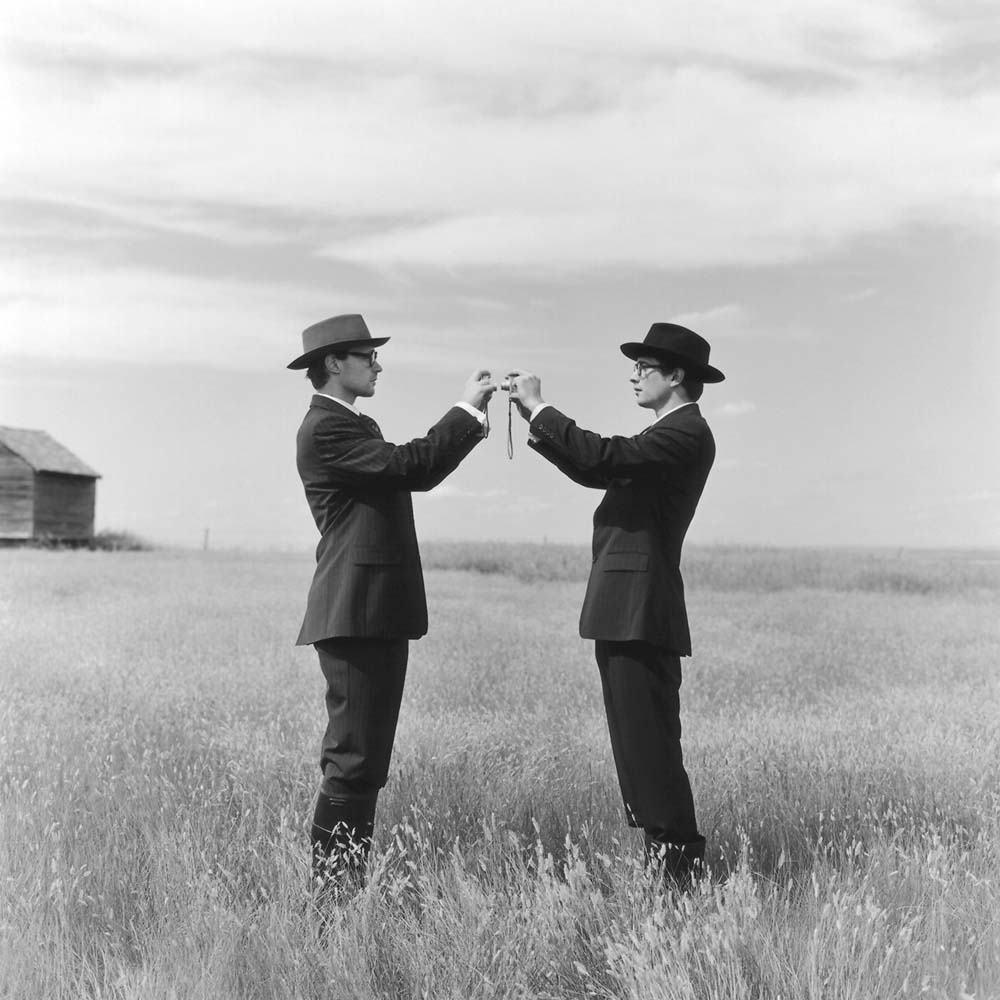 Greg and Collin Photographing each other in Field, Alberta, Canada, 2004© Rodney Smith