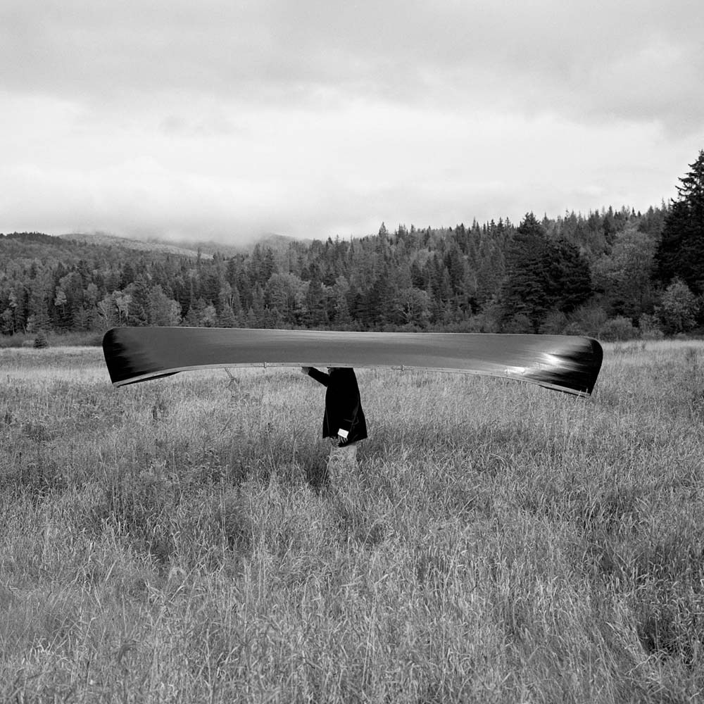 Man with Canoe on Head, Saranac, New York, 1994© Rodney Smith