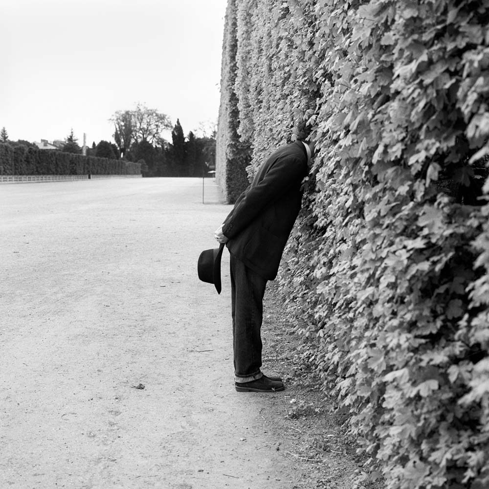 Jonah with Head in Hedge No. 1, Vienna, Austria, 1998© Rodney Smith