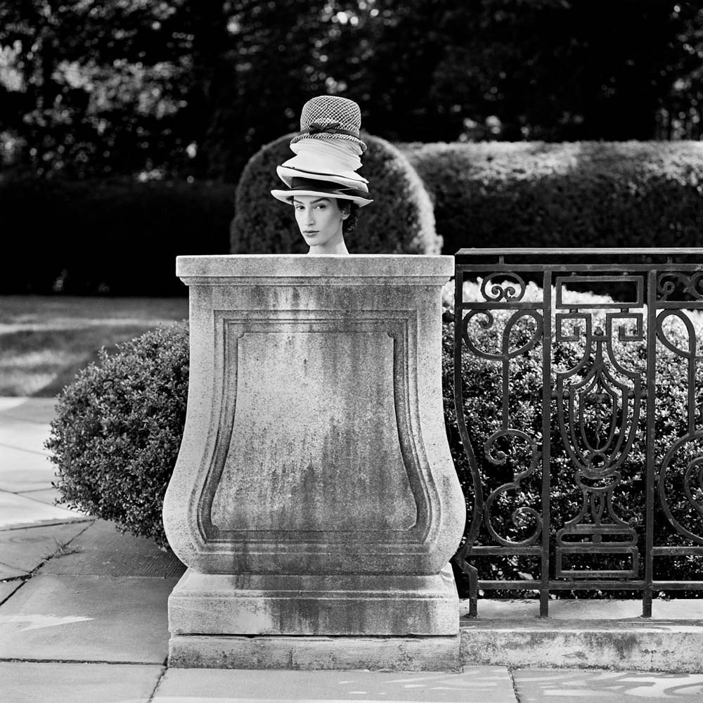 Maria Behind Pedestal with Hats, Long Island, New York, 1993© Rodney Smith