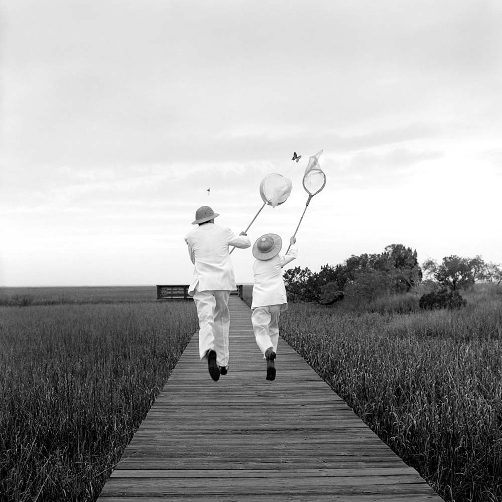 Gary And Henry Chasing Butterfly, Beaufort, South Carolina, 1996© Rodney Smith