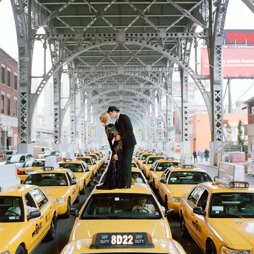Edythe and Andrew Kissing on Top of Taxis,  New York City, New York, 2008© Rodney Smith