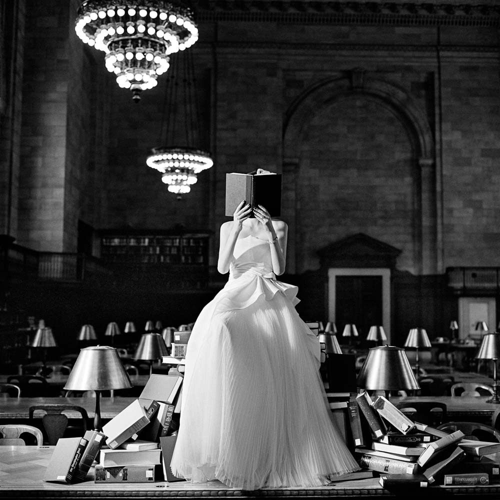 Flynn Reading on a Pile of Books, New York, New York, 2012© Rodney Smith