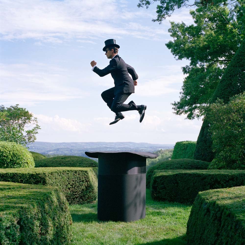Reed Floating Above Giant Top Hat, Amenia, New York, 2014© Rodney Smith